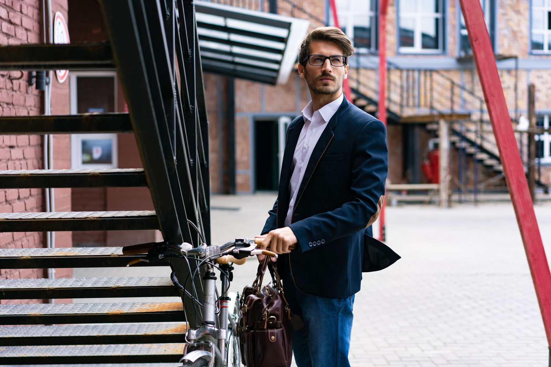 Man in suit with bicycle