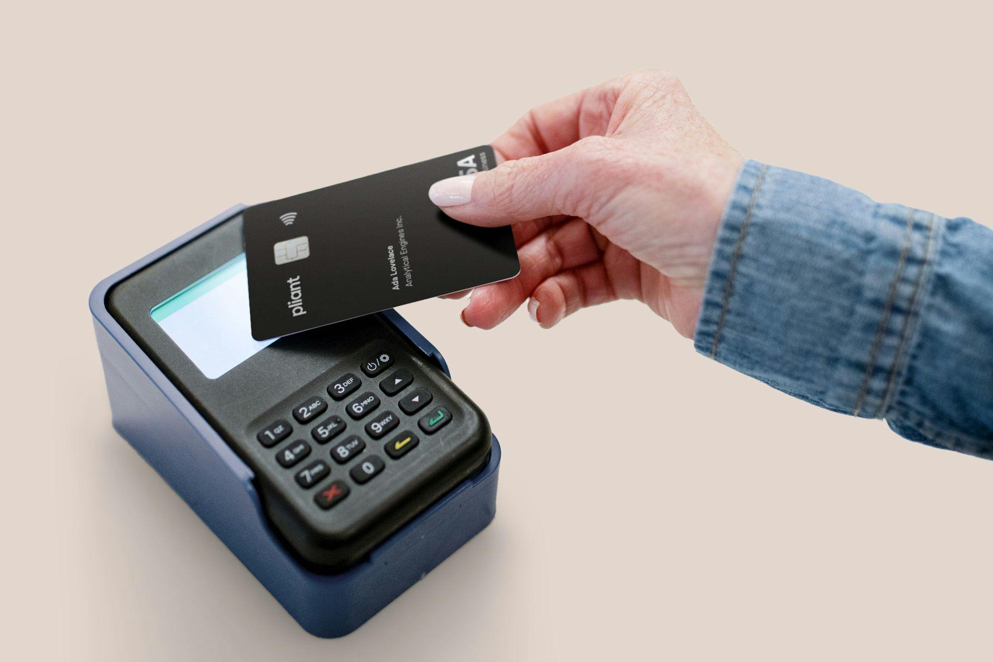 A Pliant business credit card at a payment terminal.